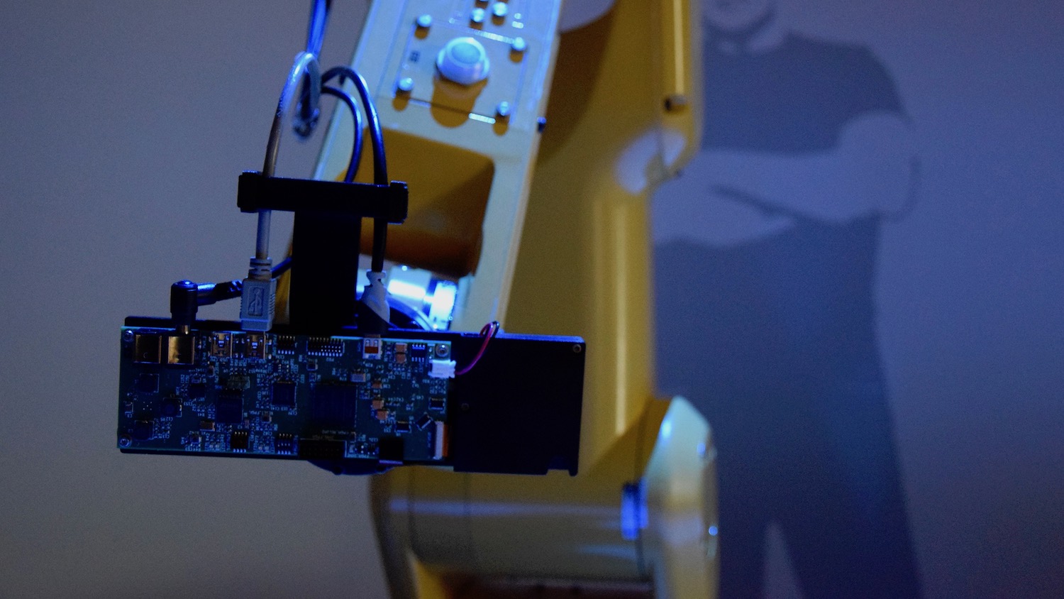 Close-up of laser projector attached to the robot arm.