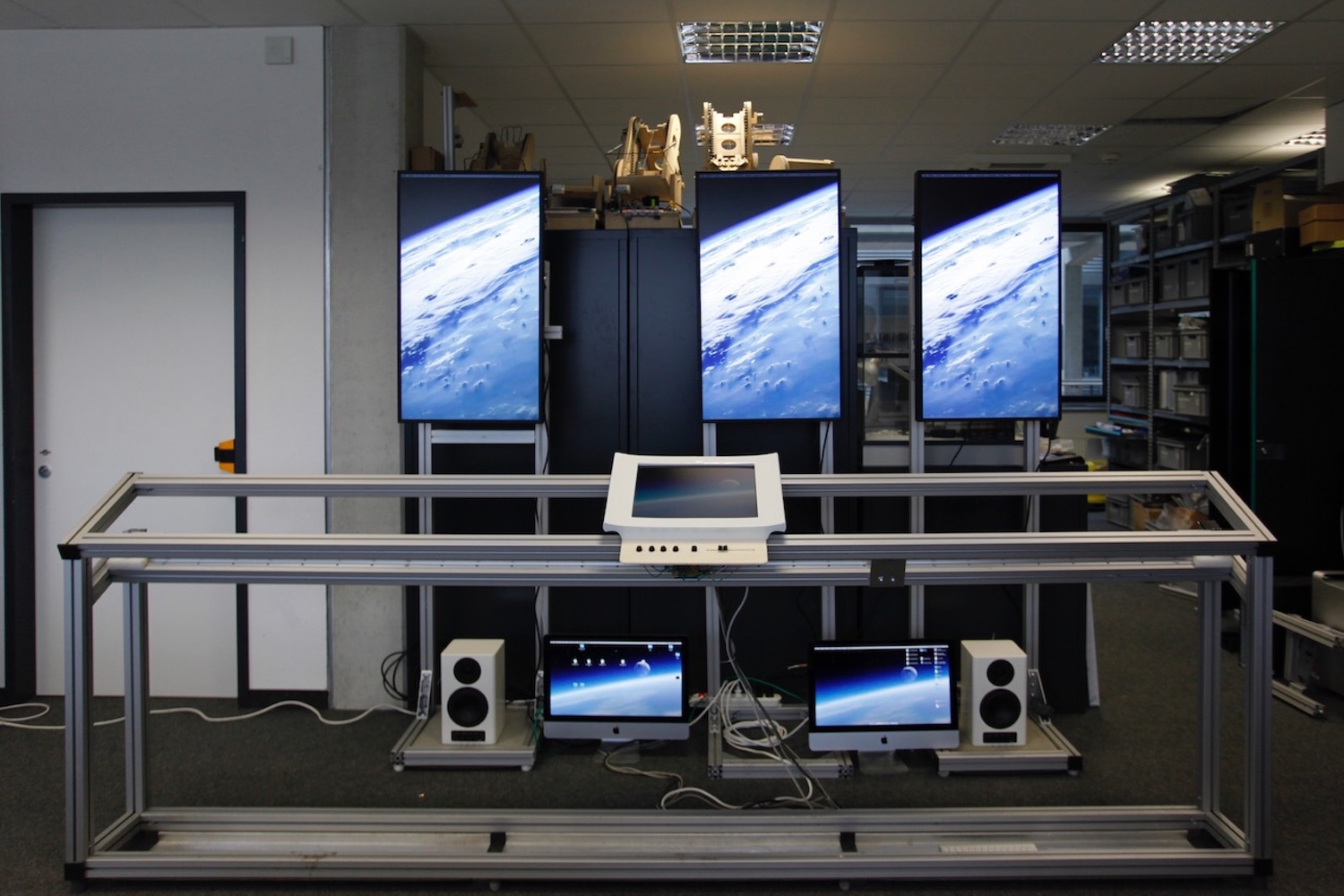 Physical structure of the Fermi Paradox exhibit, including computer and audio equipment.