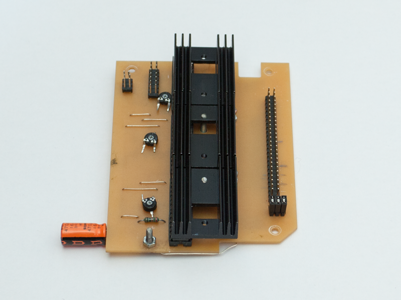 Front of PCB with heat sinks and connectors.